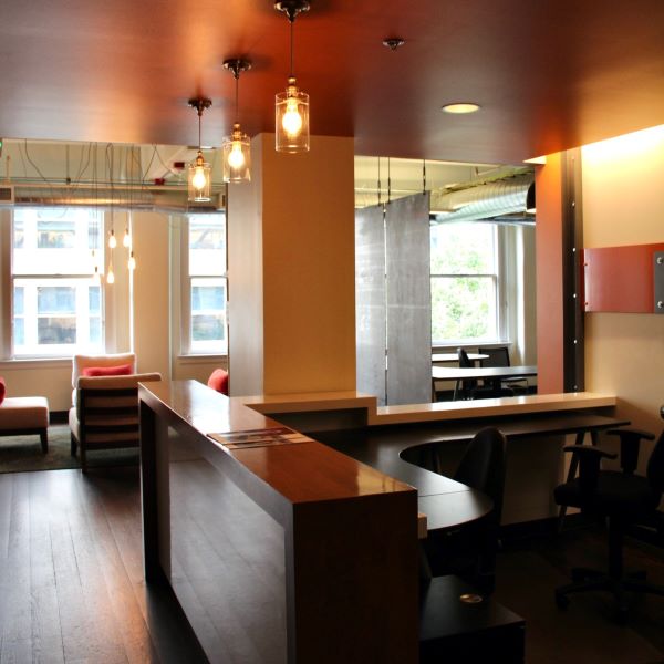 Office lobby with desk. lights, and chairs